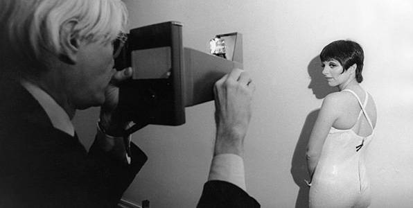 Andy Warhol photographing the actress Lisa Minnelli. The two were good friends, and Warhol made a number of screenprints of Mannelli.