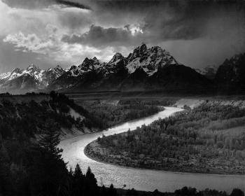 Ansel Adam's <i>Tetons and the Snake River</i> (1942) captures Group f/64's pure photography aesthetic in one of his signature landscapes.