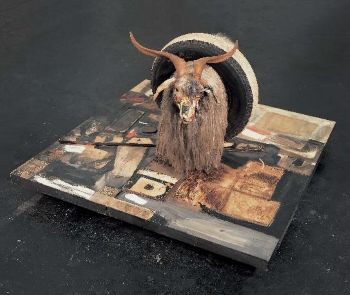 Robert Rauschenberg combined found objects and images from newspapers and magazines to create <i>Monogram</i> (1955-59)