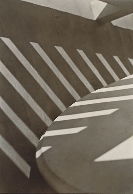 The composition of Paul Strand's <i>Porch Shadows</i> (1916) uses light, shadow, and line to create an almost-abstract photograph.