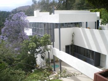 Richard Neutra's Lovell Health House showcases the International Style's use of steel, glass, and concrete.