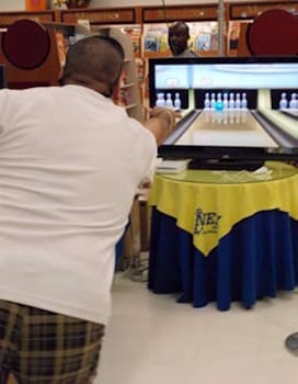 Viewer playing Arcangel's Nintendo “Wii Bowling” video game