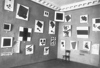 Installation photo of paintings by Kazimir Malevich, including <i>Black Square</i> in the corner, in <i>0:10:</i> <i>The Last Futurist Exhibition of Pictures</i> (1915-16)