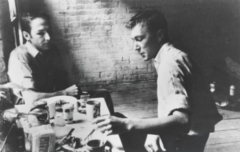 Robert Rauschenberg visits Jasper Johns's Pearl Street studio in the early days of their artistic collaborations and romantic relationship that would last several years. Photo by Rachel Rosenthal, New York (c.1954)