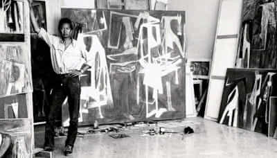 Cuban artist Wifredo Lam (pictured here in his studio in 1964) had lived in Paris during the heyday of the Negritude movement. In his particular surrealist style of Negritude art, he drew inspiration from traditional African imagery and masks.