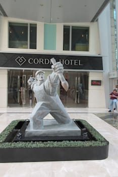 Chinese Political Pop artist Wang Guangyi combines the Social Realism style and subject matter of Chinese propaganda art with the aesthetics and materials (like fiberglass and painted resin) of contemoporary Western art, as in his <i>Materialist</i> sculpture series (2001-05), thereby juxtaposing and calling into question the tactics and objects of the communist politival agenda, and capitalism / consumer culture.