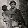 Man carrying a wounded boy, Battle of Teruel, Spain (1937)
