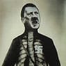 John Heartfield: Adolf, the Superman: Swallows Gold and Spouts Junk (1937)